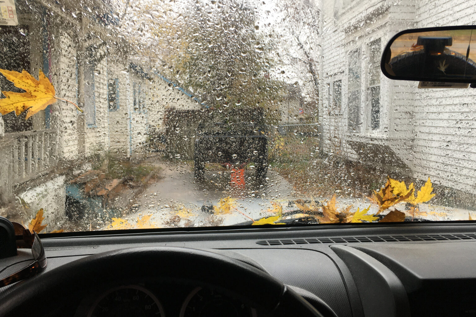 A rainstorm can be seen through the windshield of the columnist's Jeep in November 2023.